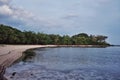 beautiful stunning tropical paradise pacific ocean sea shore beach with rainforest jungle at sunset Royalty Free Stock Photo