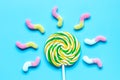 Lollipop design with sugar candys on blue background top view mockup