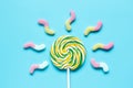 Lollipop design with sugar candys on blue background top view mockup