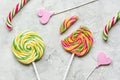 Lollipop design with sugar candys on gray background top view pattern