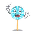 Lollipop in finger a mascot candy basket