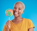 Lollipop, portrait and a woman with candy in studio for sweets, rainbow and creative advertising. Happy black female