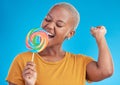 Lollipop, singing and a woman with candy in studio for sweets, rainbow and creative advertising. Happy black female