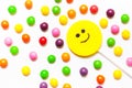 Lollipops, candy smile on, are scattered around the colorful jelly beans