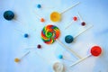 Lollipops on clouds background with paper lolly pops Royalty Free Stock Photo