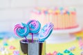 Lollipops Spiral Forms candy on pink background. Funny concept. Meringue candy on paper stick. Festive sweet table for children.
