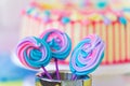 Lollipops Spiral Forms candy on pink background. Funny concept. Meringue candy on paper stick. sweet table for children. Candy Ba