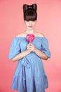 Lollypop. Beautiful teen girl with colourful heart lollipop. Fun