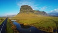 Lomagnupur Mountain, a precipitous promontory on the south coast of Iceland.Amazing Icelandic landscape with water mirror.