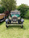 Old green Ford Model A 1928 Phaeton convertible. Front view. CADEAA 2021 classic car show. Copyspace