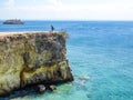 Lombok - A girl and the Pink Beach Cliff