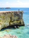 Lombok - A girl and the Pink Beach Cliff