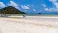 Surfers on the beach of Selong Belanak on the island of Lombok, Indonesia