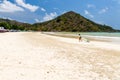 Surfers on the beach of Selong Belanak on the island of Lombok, Indonesia