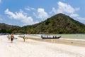 Surfers on the beach of Selong Belanak on the island of Lombok, Indonesia