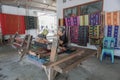 LOMBOK, INDONESIA : 16/09/2016 - Sasak lady traditionally makes yarn with a spindle wheel at traditional Sasak village, Desa Sasak