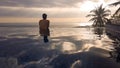 Lombok - A man enjoying the sunset in an infinity pool Royalty Free Stock Photo