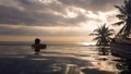 Lombok - A man enjoying the sunset in an infinity pool Royalty Free Stock Photo