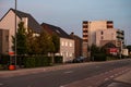 Lommel, Limburg, Belgium - Sunset view over a road and contemporary residential buildings Royalty Free Stock Photo