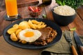 Lomo a lo Pobre - Traditional Chilean Food - Meat, rice, chips and caramelized onion Royalty Free Stock Photo