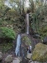 Lomo Magullo, Gran Canaria, Canary Islands, Spain December 25, 2020: Small waterfall at lush landscape of Barranco de