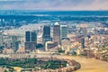 London aerial view from helicopter. Canary Wharf skyscrapers along River Thames Royalty Free Stock Photo