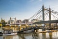 London, Albert bridge in Chelsea and Thames river at sunset