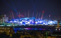 London arena under light performing. City lights background.