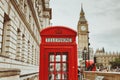 LONDON - AUGUST 23, 2017: Red telephone booth and Big Ben in Lon Royalty Free Stock Photo