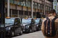 London black cabs queuing at a cab stand outside Kings Cross station Royalty Free Stock Photo