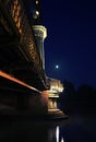 Bridge rests quitely as moon watches on