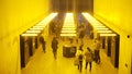 London, Britain-September, 2019: Public corridor in building with yellow light. Action. Underground city public transit