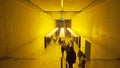 London, Britain-September, 2019: Public corridor in building with yellow light. Action. Underground city public transit