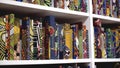 London, Britain-September, 2019: Shelves with lots of books with colorful and bright covers. Action. White shelves with