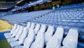 London, Britain-September, 2019: View of empty blue stands in front rows. Action. First seats in stands for VIP persons