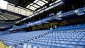 London, Britain-September, 2019: View of empty blue stands in front rows. Action. First seats in stands for VIP persons