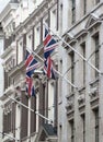 LONDON, British flags on building facade. City of London