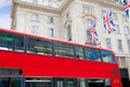 London Bus and UK flags in Piccadilly Circus Royalty Free Stock Photo