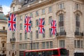 London Bus and UK flags in Piccadilly Circus Royalty Free Stock Photo