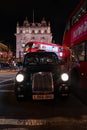 London cab front view. Classical taxi cab in London. Royalty Free Stock Photo