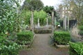 Chelsea physic garden formal path around bushes and flowerbeds Royalty Free Stock Photo