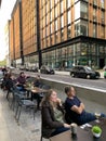 London city with restaurants table on the sidewalk to help the hospitality industry recover from covid crisis