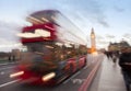 London city scene with red bus and Big Ben in background. Royalty Free Stock Photo