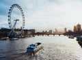 London skyline at sunrise with famous landmarks: London Eye, County Hall, Westminster Bridge, Houses of Parliament, Big Ben and