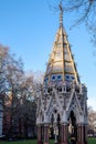 LONDON - DEC 9 : Buxton Memorial Fountain in Victoria Tower Gardens in London on Dec 9, 2015. Unidentified people.