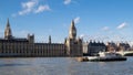 LONDON - DEC 9 : Working Boats in Front of the Houses of Parliament in London on Dec 9, 2015. Unidentified people.