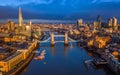 London, England - Aerial skyline view of London including iconic Tower Bridge with red double-decker bus Royalty Free Stock Photo