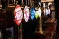 London, England - APRIL 1, 2019: Draught beer taps in a traditional pub in London Royalty Free Stock Photo