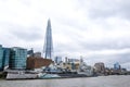 London, England, April 5 2022 - View from the River Thames of HMS Belfast with city buildings in the background Royalty Free Stock Photo