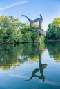 Bird sculpture West Lake in Victoria Park reflected in calm water by Artist Erno Bartha installed in 2012